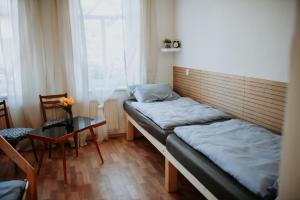 Postel nebo postele na pokoji v ubytování Dráchovský dvorek