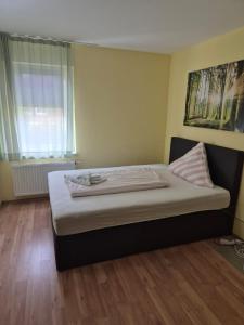 Postel nebo postele na pokoji v ubytování Hotel Lindenthal