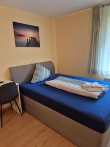 Postel nebo postele na pokoji v ubytování Hotel Lindenthal