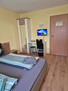 TV a/nebo společenská místnost v ubytování Hotel Lindenthal