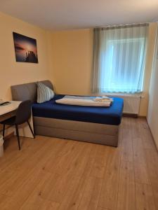Postel nebo postele na pokoji v ubytování Hotel Lindenthal
