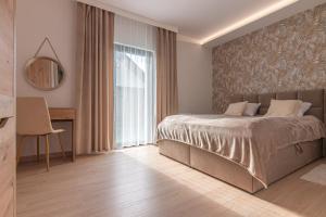 Posteľ alebo postele v izbe v ubytovaní Bianco Apartamenty Laskowa - Zator