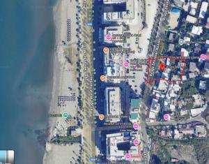 a map of a beach with red and green circles at Azure Waves in Vlorë