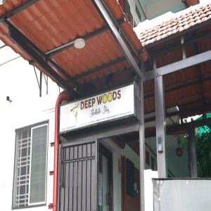 a sign for a beer wood shop on a building at Deepwoods Stay-Kinathukadavu, Coimbatore in Coimbatore
