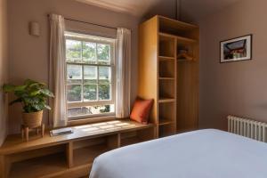 a bedroom with a bed and a window at Leworth Apartments, Windsor in Windsor