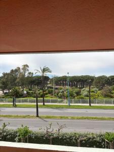 a view from a window of a street at Élégant T2 acces direct plage in Saint-Cyprien-Plage
