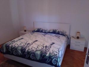 a bedroom with a bed and two night stands at Gajeta in Betina