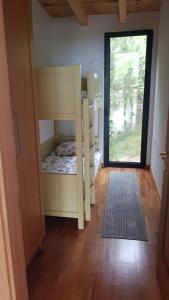 a room with a bed and a door with a window at Villa Ela - Cape of Rodon in Draç +16 photos