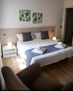 Postel nebo postele na pokoji v ubytování Conte Durini Apartments & Rooms