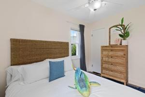 a bedroom with a bed with a fish on it at Smyrna Sol in New Smyrna Beach