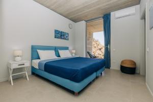 Ένα ή περισσότερα κρεβάτια σε δωμάτιο στο Ambi Homes 3