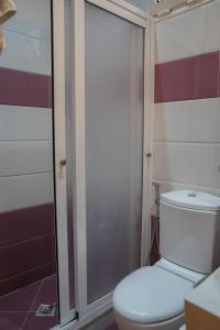 a bathroom with a toilet and a shower at Arina beach martil in Martil +6 photos