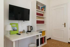 TV a/nebo společenská místnost v ubytování casa a colori