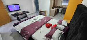 Postel nebo postele na pokoji v ubytování Exit apartmani