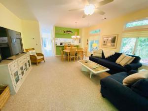 a living room with a couch and a table at Spring lake 601 in Rehoboth Beach
