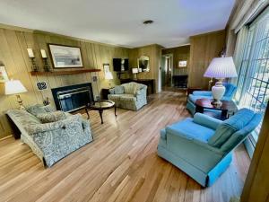 a living room with blue furniture and a fireplace at Oak avenue 33 in Rehoboth Beach