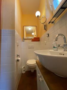a bathroom with a sink and a toilet at Badehaus Villa Fiedrichs in Ilmenau +16 photos