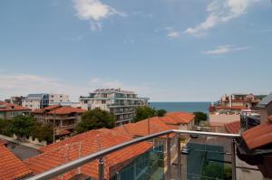 a view of a city with buildings and the ocean at Guest House Hiora in Ahtopol