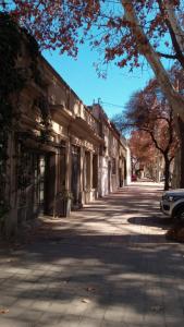 an empty street in a city with a building at Loft Rufino in Mendoza