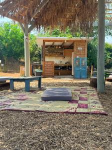 a mattress on a rug in front of a building at חוות רפאל in Mashabbe Sade