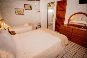Postel nebo postele na pokoji v ubytování Hotel Fundo El Arrabal