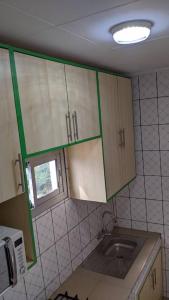 Kuchyň nebo kuchyňský kout v ubytování POUANGO Home