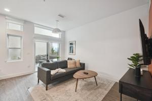 a living room with a couch and a table at Southwestern Charm | Espadin LoHi in Denver