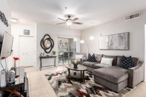 a living room with a couch and a table at Southern #1064 Mesa in Mesa