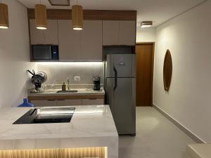 Η κουζίνα ή μικρή κουζίνα στο Juquehy Praia Dhayamond