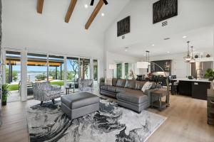 a living room with a couch and a table at Heavenly Retreat - 5BD of Waterfront Living in Thackerville