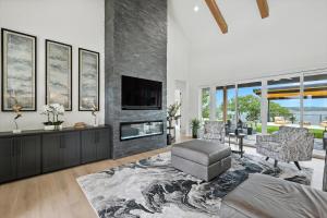 a living room with a fireplace and a tv at Heavenly Retreat - 5BD of Waterfront Living in Thackerville +67 photos