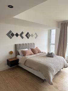 Postel nebo postele na pokoji v ubytování MarDelSuites - Studio Estándar Piso 12 a Pasos del Mar, Amenities, Seguridad 24hrs, Cochera Opcional