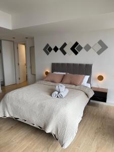 Postel nebo postele na pokoji v ubytování MarDelSuites - Studio Estándar Piso 12 a Pasos del Mar, Amenities, Seguridad 24hrs, Cochera Opcional