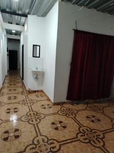 a room with a stage with a red curtain at Apartamento por noches en Doradal in Las Mercedes