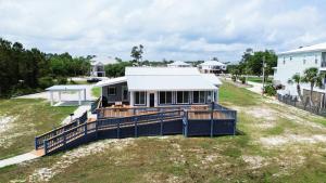 an aerial view of a house with a porch at Recently Updated Home w/ Private Pier/Boat Slip in Orange Beach