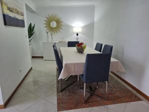 a dining room with a table and chairs and a mirror at Casa da Boa Vista in Burguete +19 photos