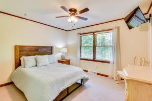 a bedroom with a bed and a ceiling fan at Deck and Game Room Mountaintop Hideaway in Tiger! in Tiger