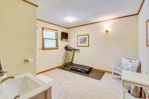 a room with a gym with a treadmill and a sink at Deck and Game Room Mountaintop Hideaway in Tiger! in Tiger