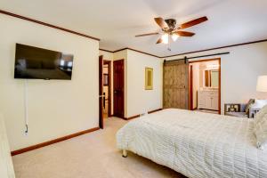 a bedroom with a bed and a ceiling fan at Deck and Game Room Mountaintop Hideaway in Tiger! in Tiger
