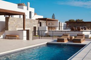 a villa with a swimming pool and a house at Ayana in Naxos Chora