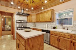 a kitchen with wooden cabinets and a counter top at Knickerbocker retreat #2321 in Big Bear Lake