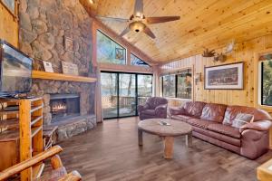 a living room with a couch and a fireplace at Lake shore #012 in Big Bear Lake