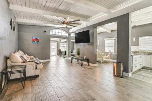 a living room with a couch and a ceiling fan at Boat, Fish and Explore Hudson Home with Private Dock in Hudson