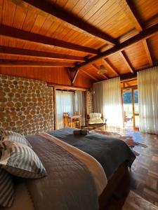 Katil atau katil-katil dalam bilik di Divina Reserva- Cabana Hortelã