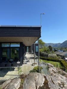 a modern house on top of a rock at Villa Vaaganeset in Lii