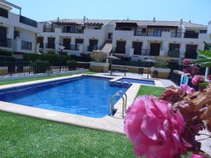 a swimming pool in front of a building at You & Me in Jávea