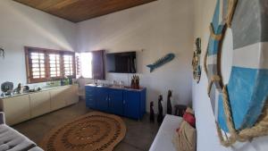 a kitchen with a blue cabinet and a sink at Casa obster barrinha in Barra Grande