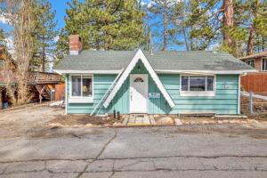 a blue house with a white door at Storyville #2294 in Big Bear Lake
