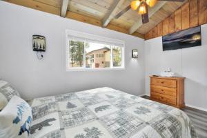 a bedroom with a bed and a window at Storyville #2294 in Big Bear Lake