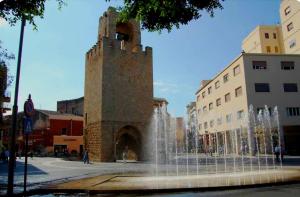a water fountain in the middle of a city at Yuna&Stella in Oristano
